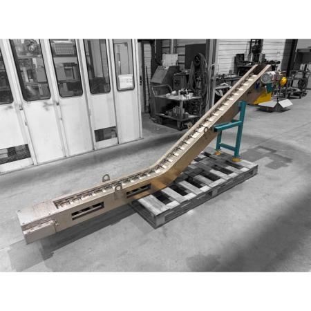 Convoyeur à raclettes pour l'évacuation de minerais